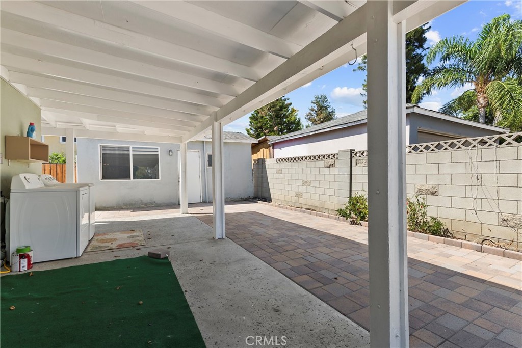 19709 Strathern Street Winnetka, CA 91306 - Photo 24 of 31 a front view of a house with a yard and garage
