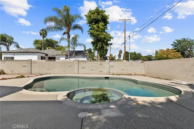 a view of a swimming pool with a patio