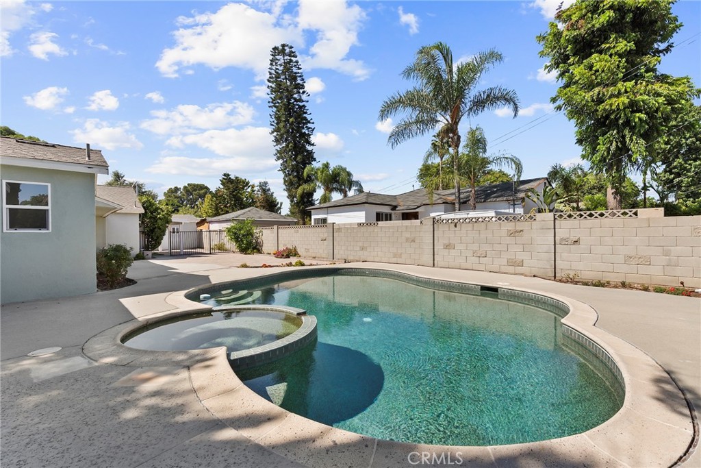 19709 Strathern Street Winnetka, CA 91306 - Photo 27 of 31 a view of a swimming pool with a patio