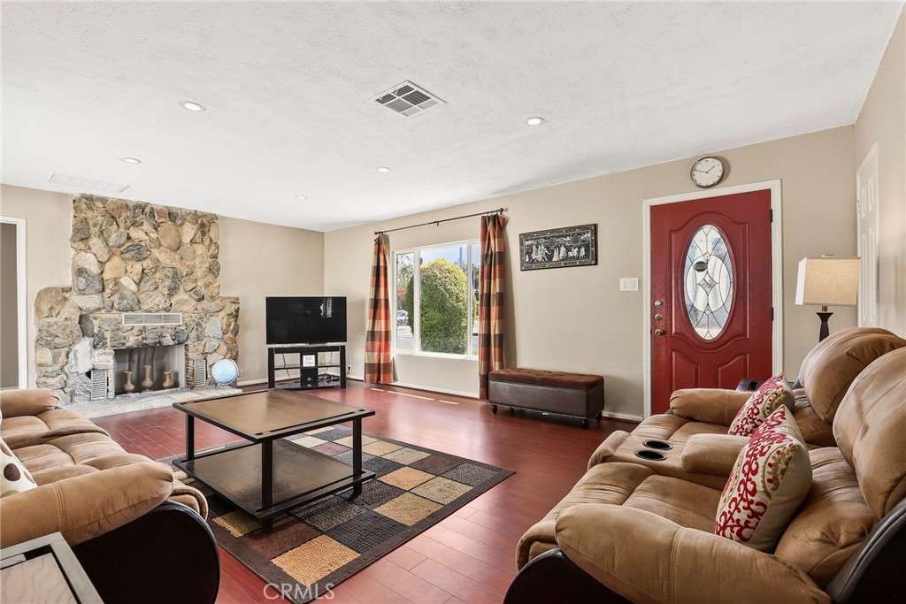 19709 Strathern Street Winnetka, CA 91306 - Photo 5 of 31 a living room with furniture and a flat screen tv