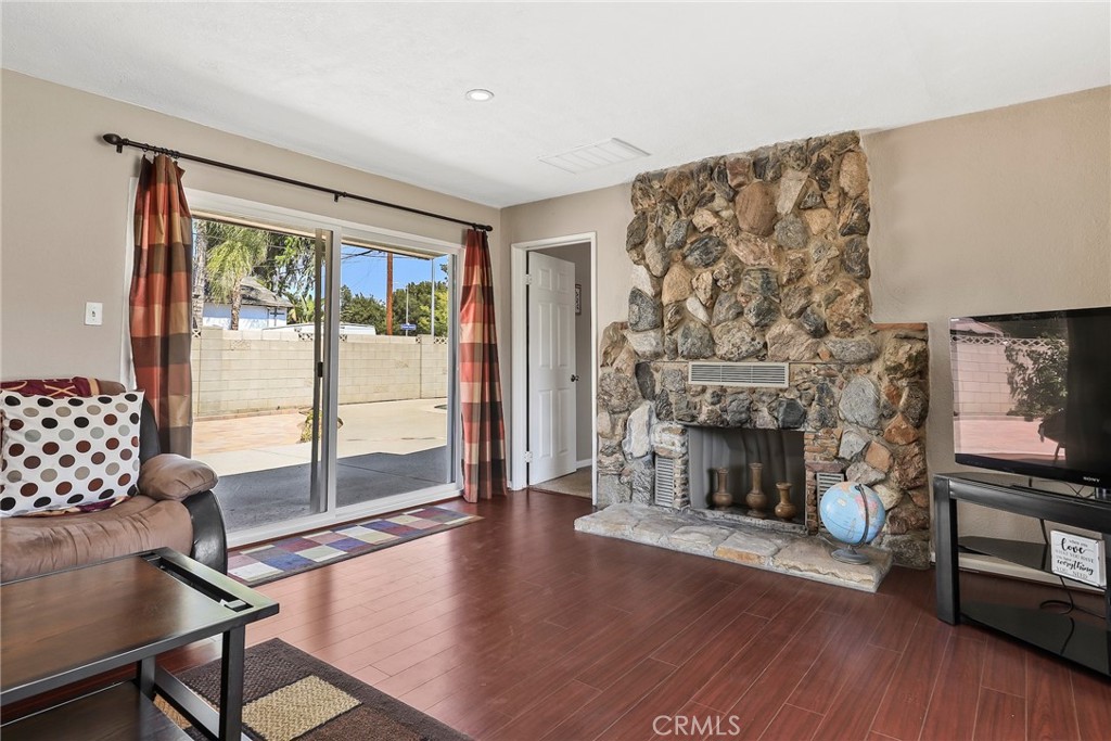 19709 Strathern Street Winnetka, CA 91306 - Photo 7 of 31 a living room with furniture and a fireplace