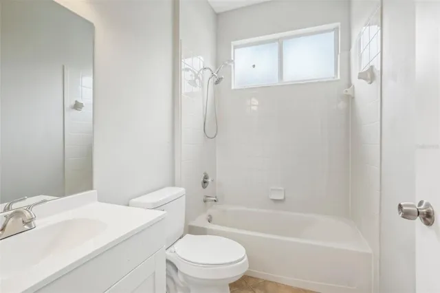 a bathroom with a sink a toilet and a bathtub