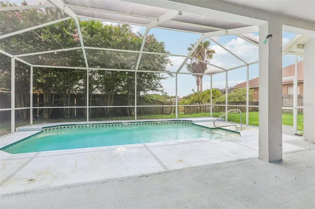 a view of a house with a big yard and potted plants