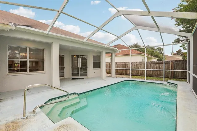 a view of an house with backyard porch and sitting area