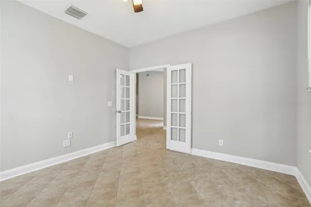 an empty room with a empty space and windows