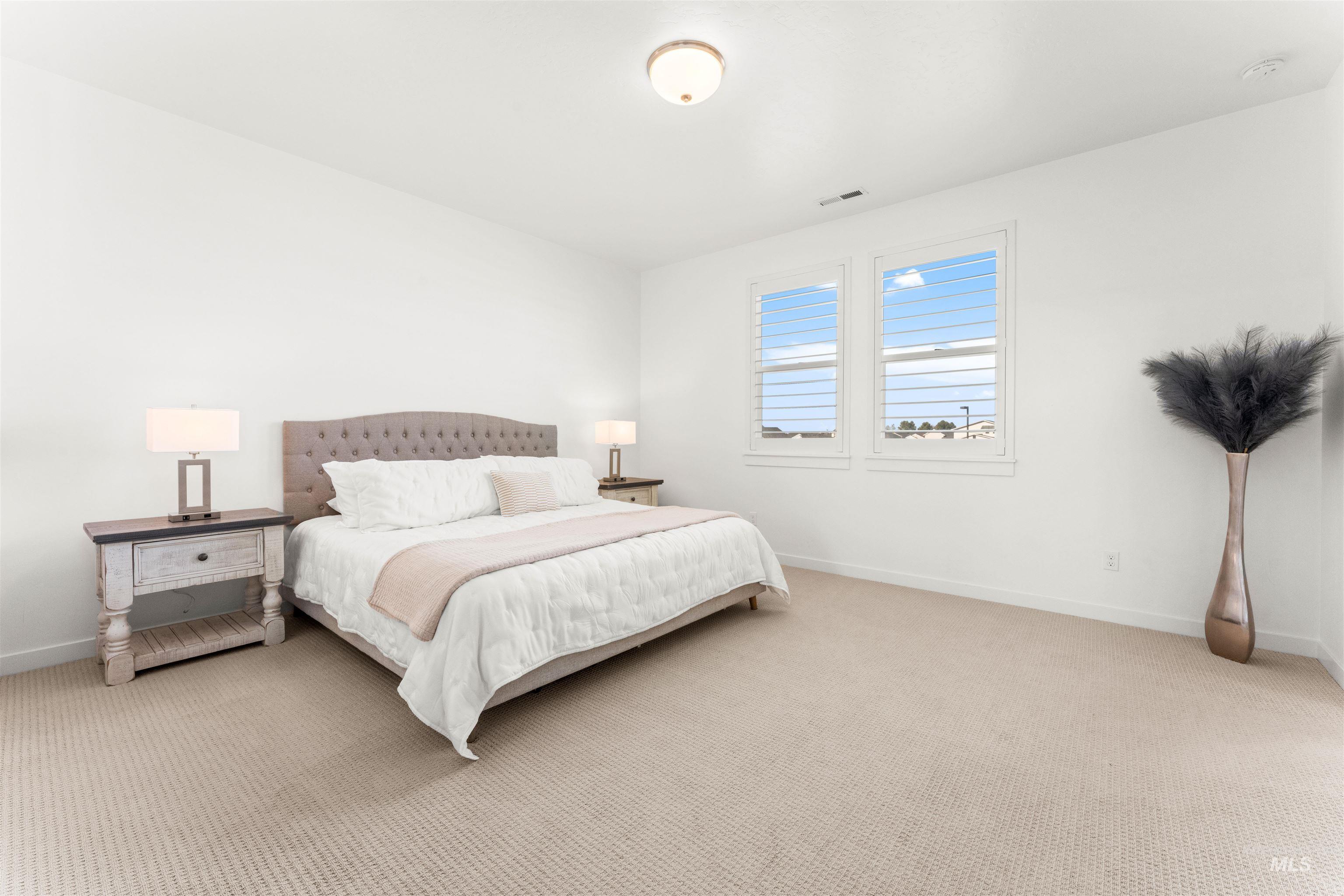 2040 West Gelding Street Middleton, ID 83644 - Photo 18 of 22 Carpeted bedroom featuring baseboards
