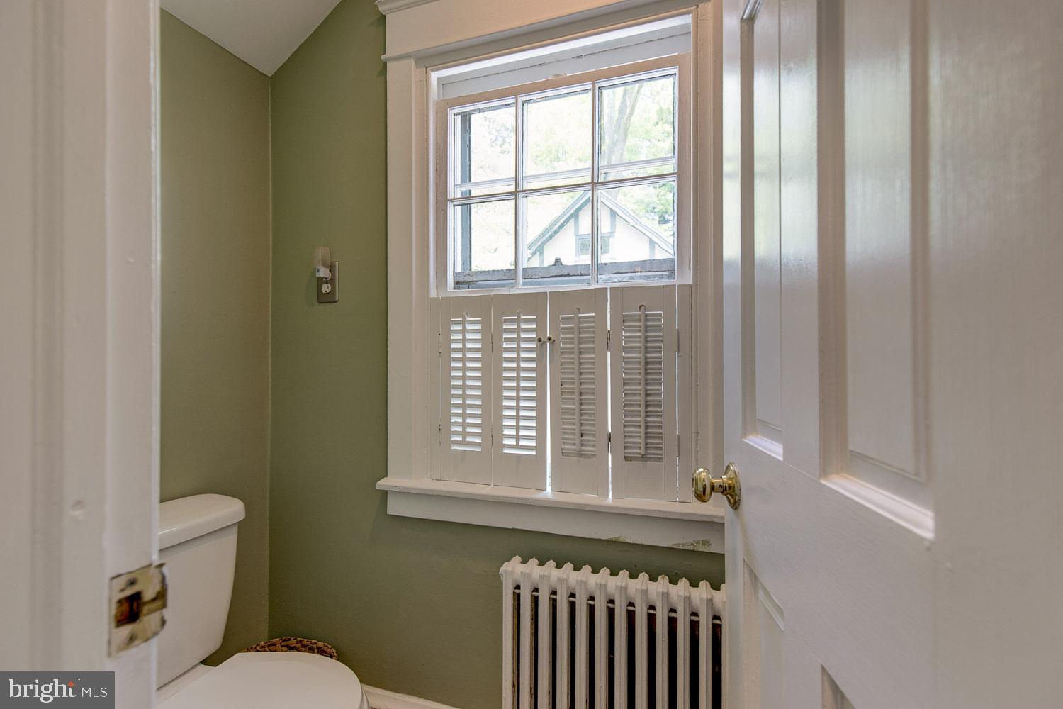 199 Woodward Road Media, PA 19063 - Photo 13 of 32 POwder Room is at back of Kitchen.