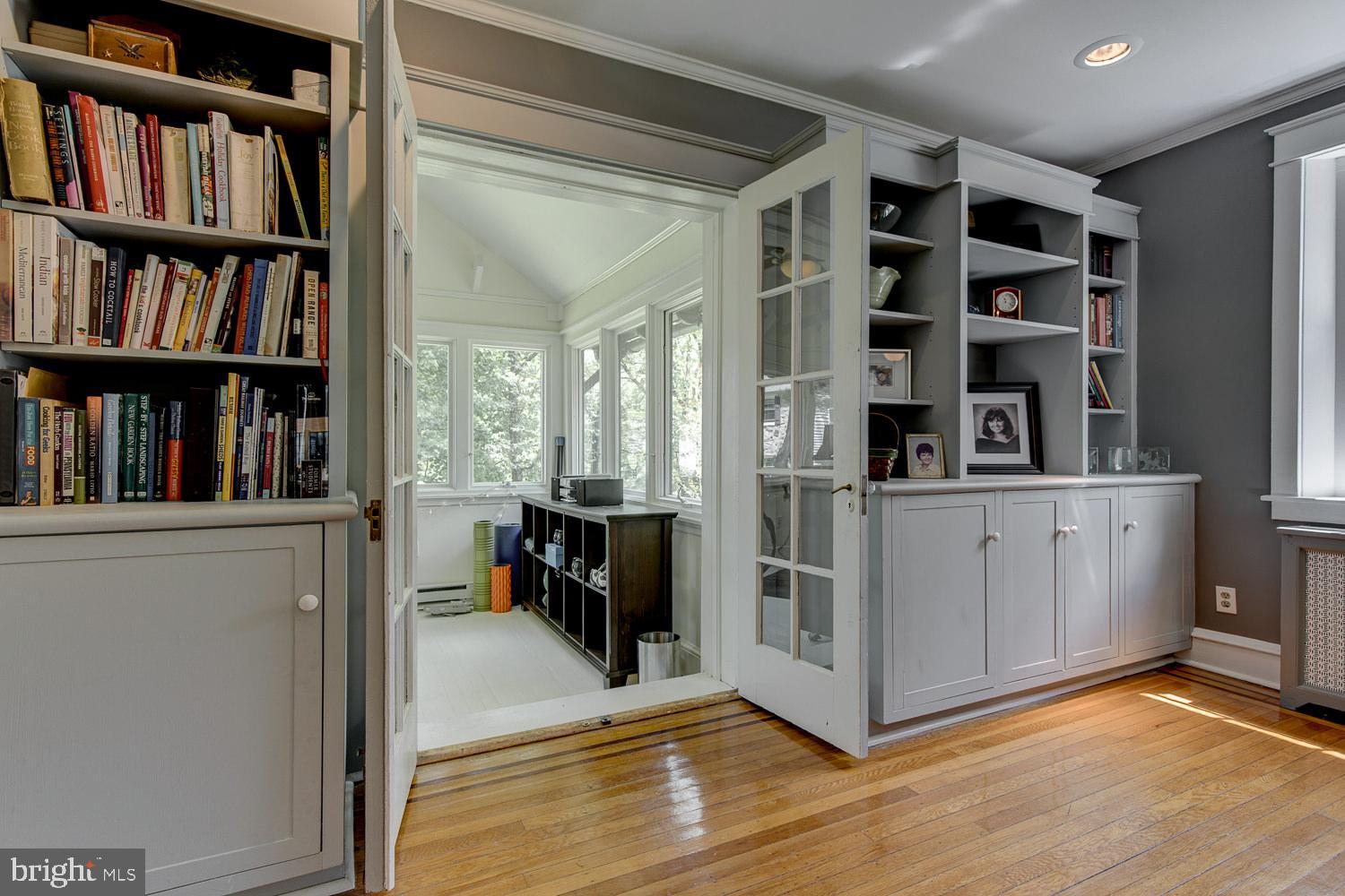 199 Woodward Road Media, PA 19063 - Photo 5 of 32 Built in LIving Room Shelving off Sunroom