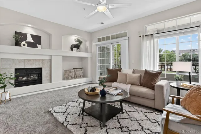 a living room with furniture and a fireplace