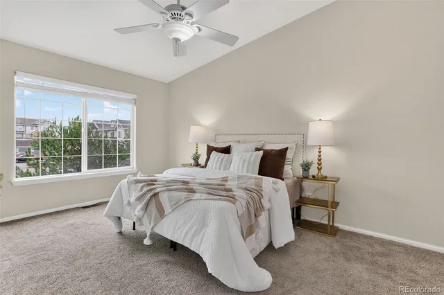 a bed room with a bed and a chandelier