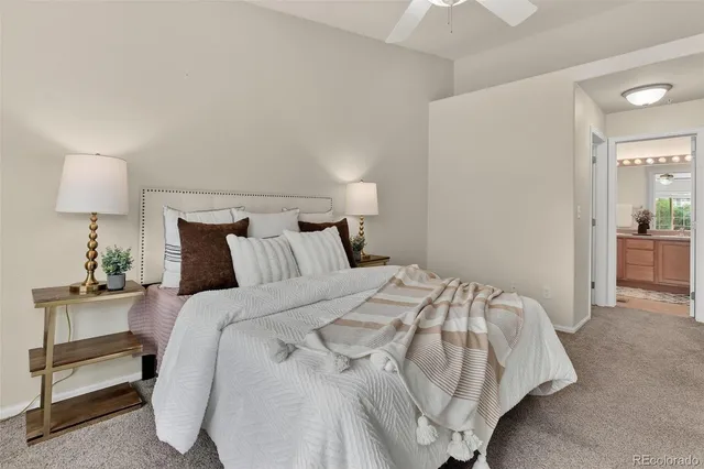 a bedroom with a bed and a lamp