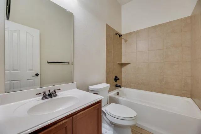 a bathroom with a sink a toilet and a bathtub