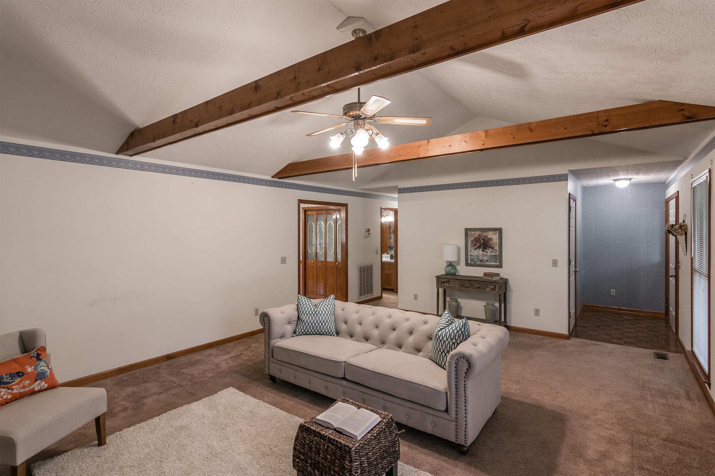 202 Bell Lane Springfield, TN 37172 - Photo 6 of 23 a living room with furniture and a chandelier