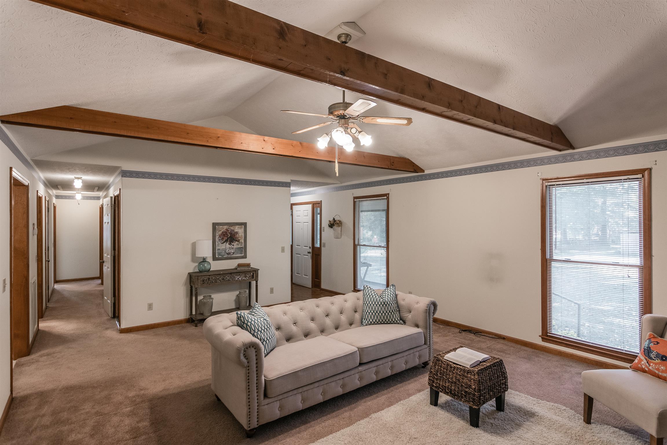 202 Bell Lane Springfield, TN 37172 - Photo 7 of 23 a living room with furniture and a chandelier
