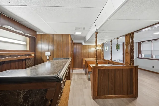 a kitchen with stainless steel appliances granite countertop a stove and a refrigerator