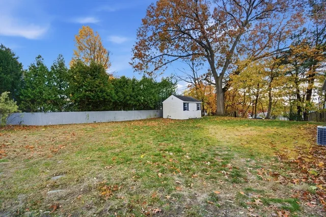 a house view with swimming pool in front of it