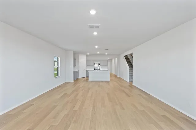 a view of a kitchen with a sink and cabinets