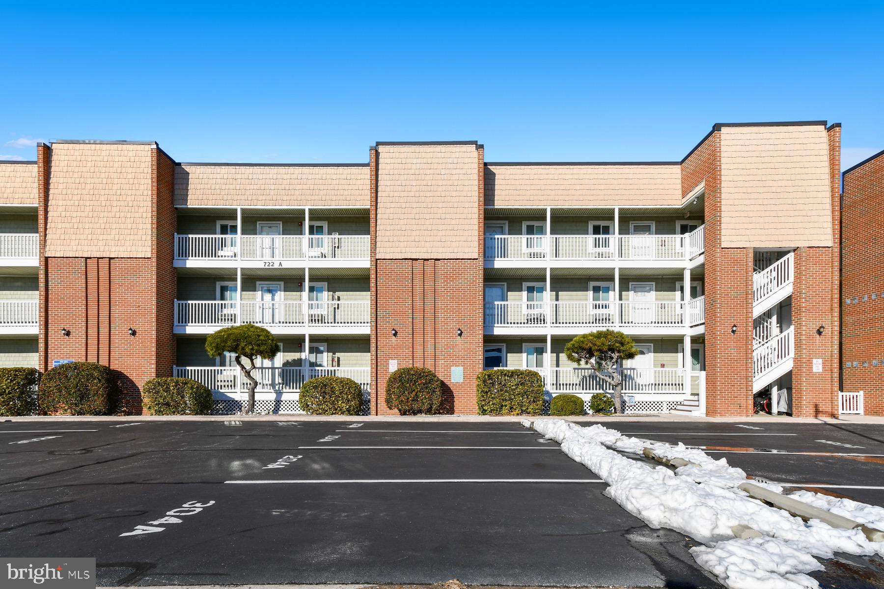 722 Mooring Road, Unit A104 Ocean City, MD 21842 - Photo 31 of 33 a flower garden is sitting in front of a building