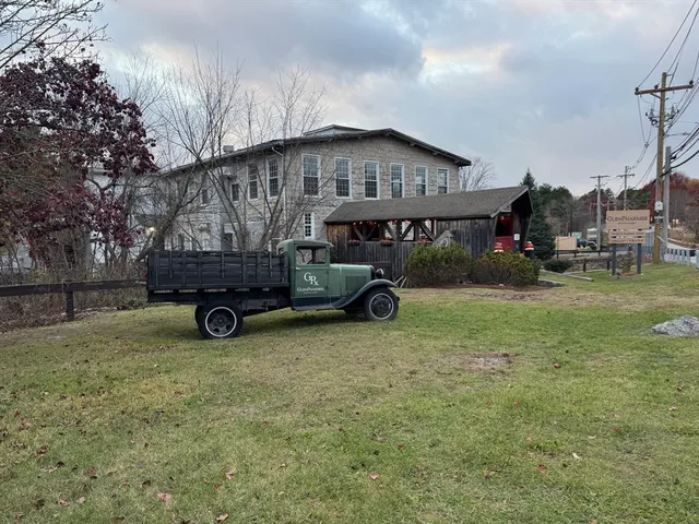 a view of a house with truck parked in front of a house