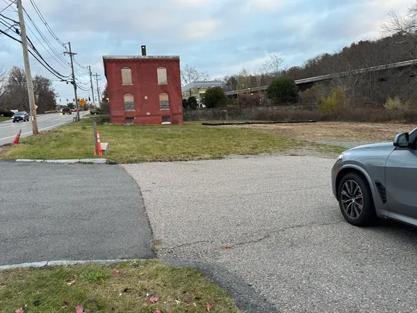 a view of a car parked in front of a house