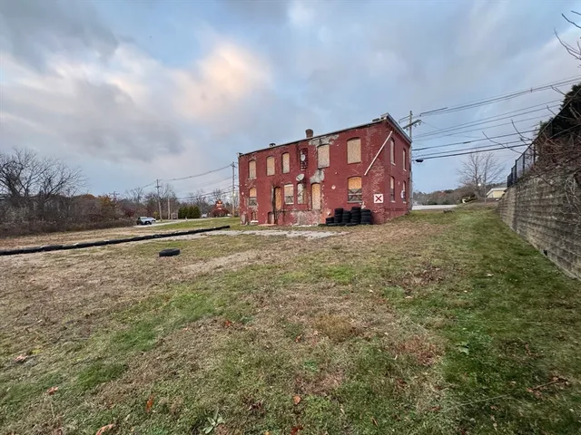 a view of a big yard with an trees