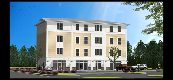 a front view of a building with garden