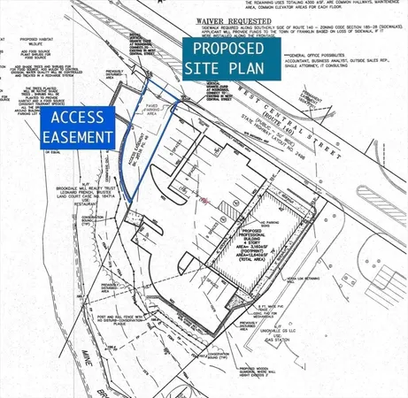 a sign on a street next to a building