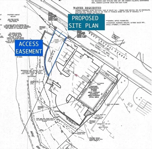 a sign on a street next to a building