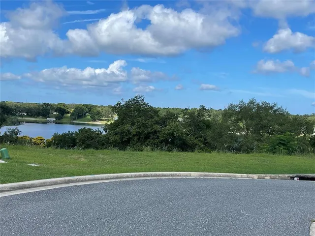 a view of a golf course with a lake