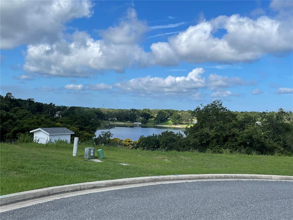 1110 Country Club Road Eustis, FL 32726 - Photo 28 of 38 a view of a golf course with car parked