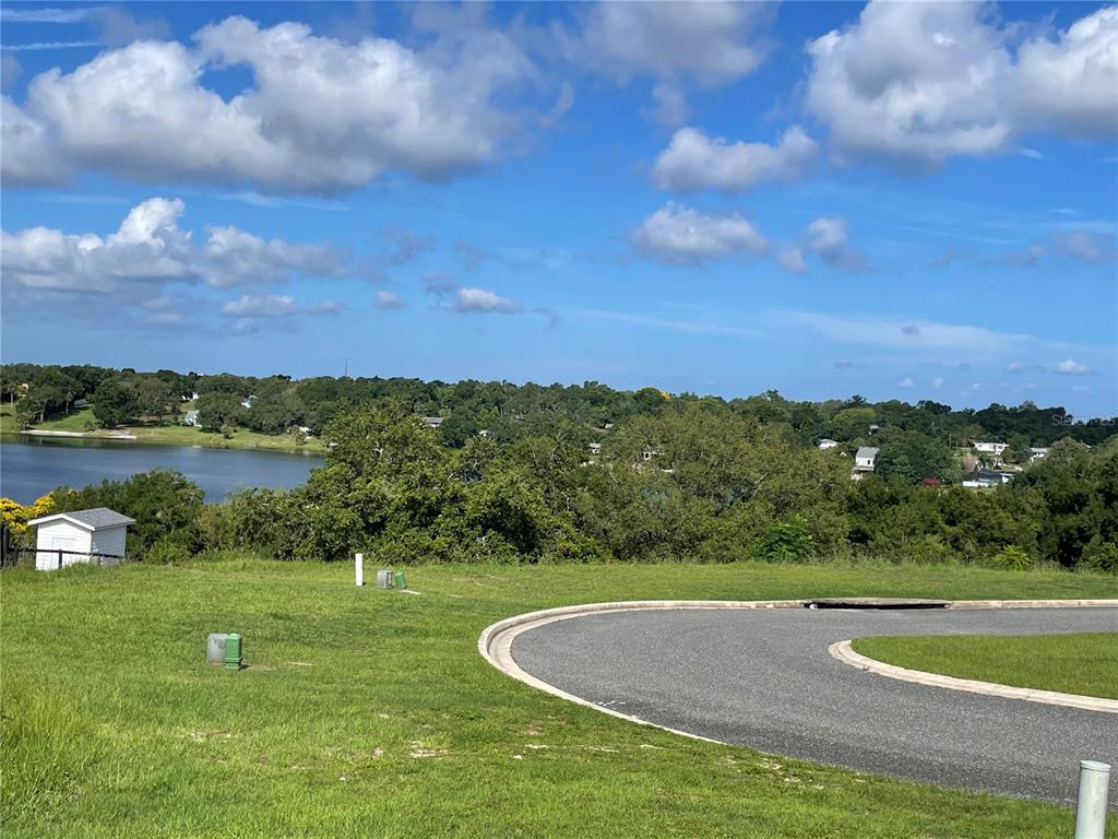 1110 Country Club Road Eustis, FL 32726 - Photo 32 of 38 a view of a lake with houses in the back