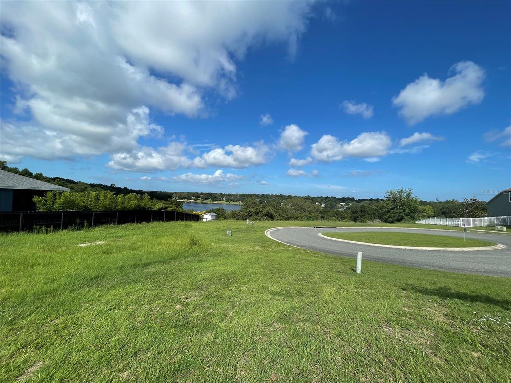 1110 Country Club Road Eustis, FL 32726 - Photo 34 of 38 a view of a lake with a big yard