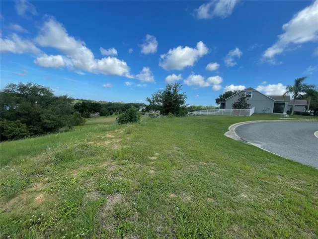a view of a golf course with green space