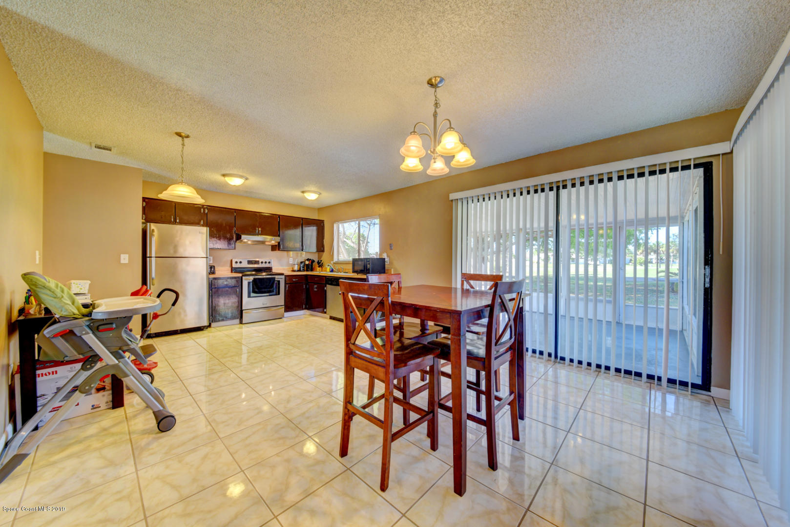 1300 Cromey Road Northeast Palm Bay, FL 32905 - Photo 16 of 29 a view of a dining room with furniture