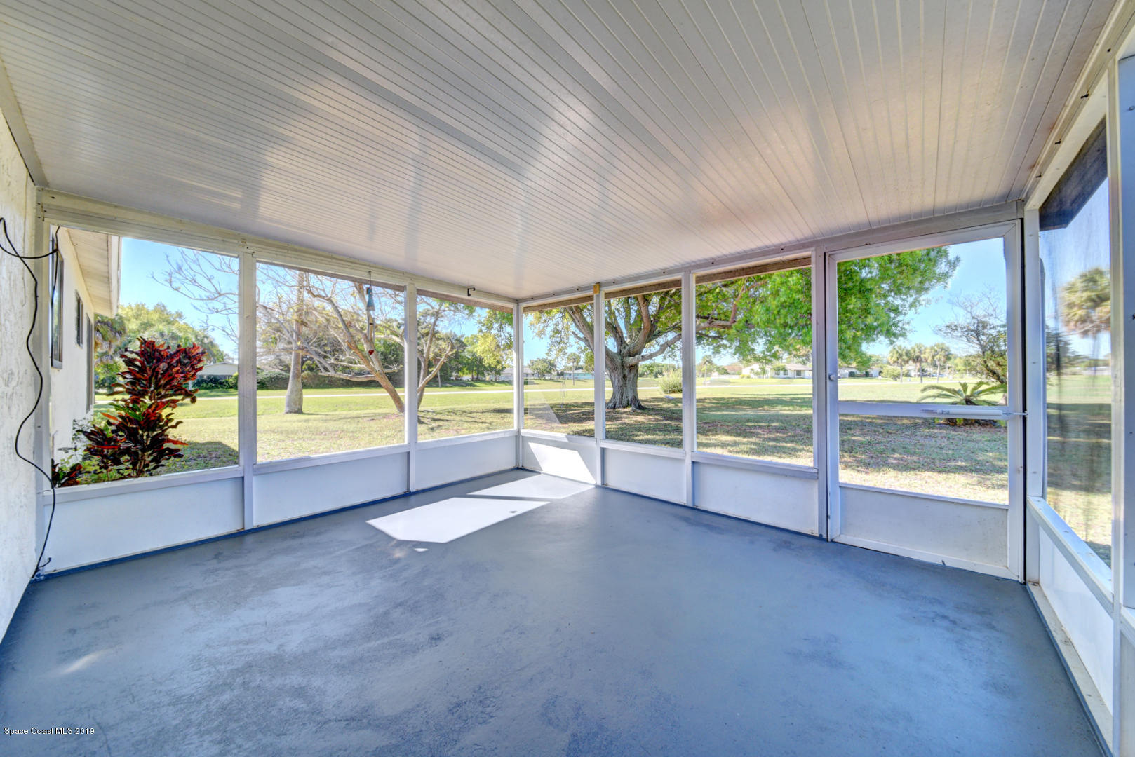 1300 Cromey Road Northeast Palm Bay, FL 32905 - Photo 24 of 29 a view of an empty room with a balcony