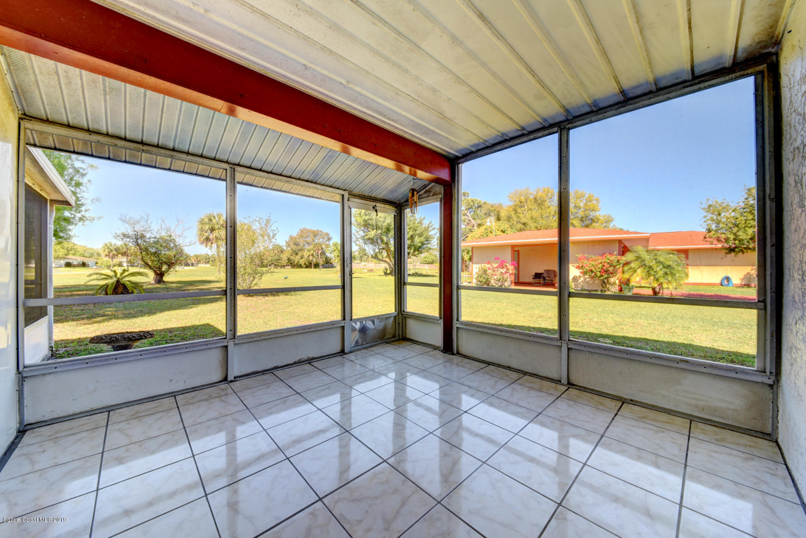 1300 Cromey Road Northeast Palm Bay, FL 32905 - Photo 25 of 29 a view of an empty room with windows