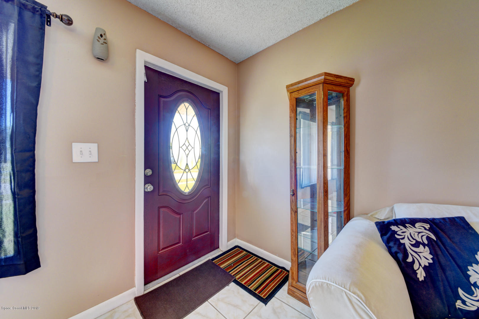 1300 Cromey Road Northeast Palm Bay, FL 32905 - Photo 4 of 29 a view of entryway with wooden floor