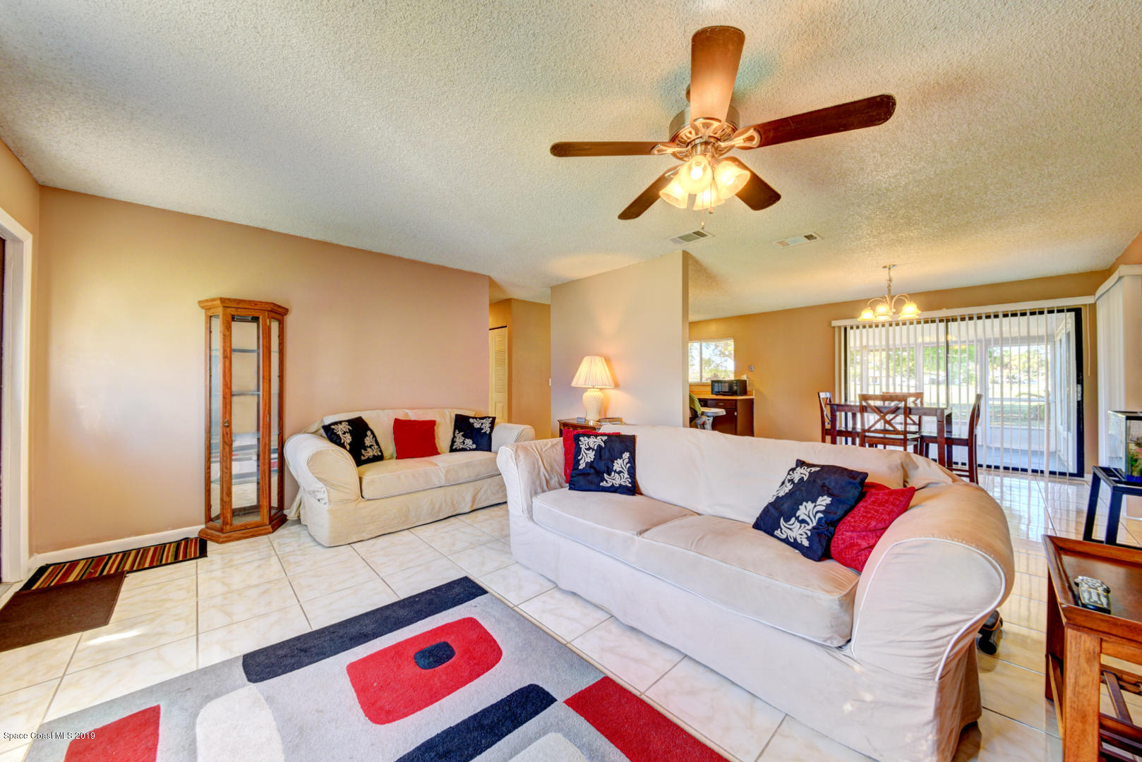 1300 Cromey Road Northeast Palm Bay, FL 32905 - Photo 6 of 29 a living room with furniture and a window