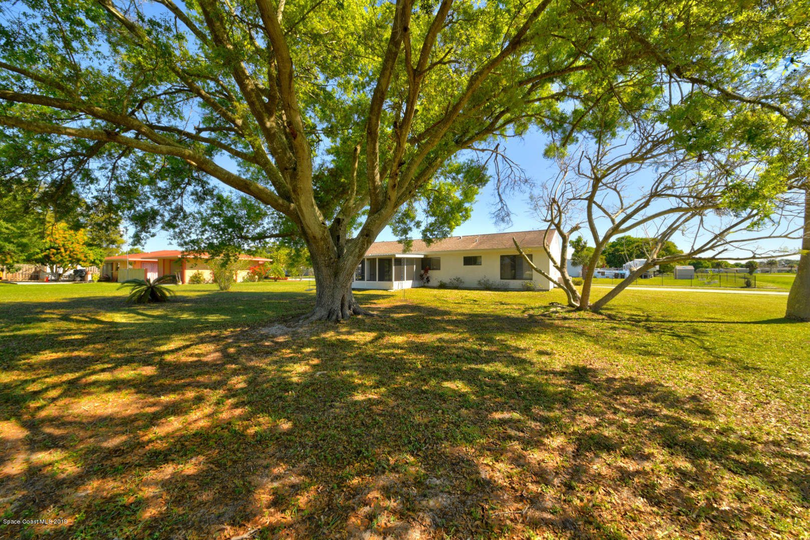 1300 Cromey Road Northeast Palm Bay, FL 32905 - Photo 9 of 29 a front view of a house with a yard