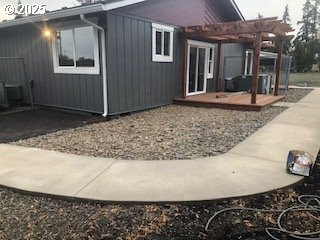 704 Patrol Street Molalla, OR 97038 - Photo 25 of 29 a view of a house with a balcony