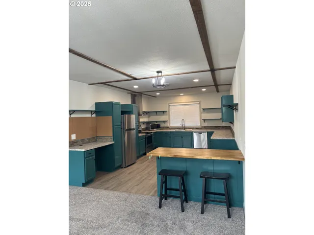 a kitchen with a sink cabinets and counter space