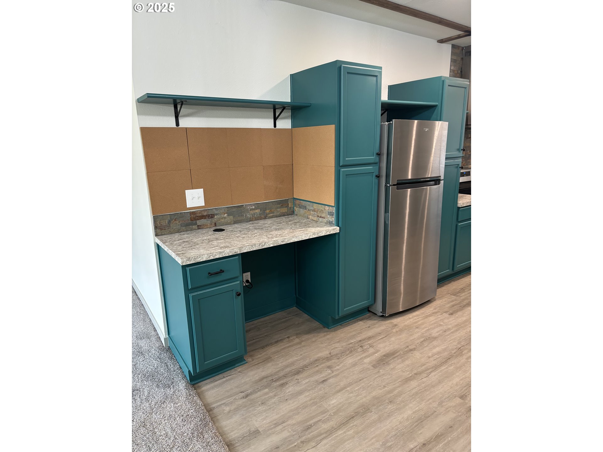 704 Patrol Street Molalla, OR 97038 - Photo 6 of 29 a room with cabinets and refrigerator