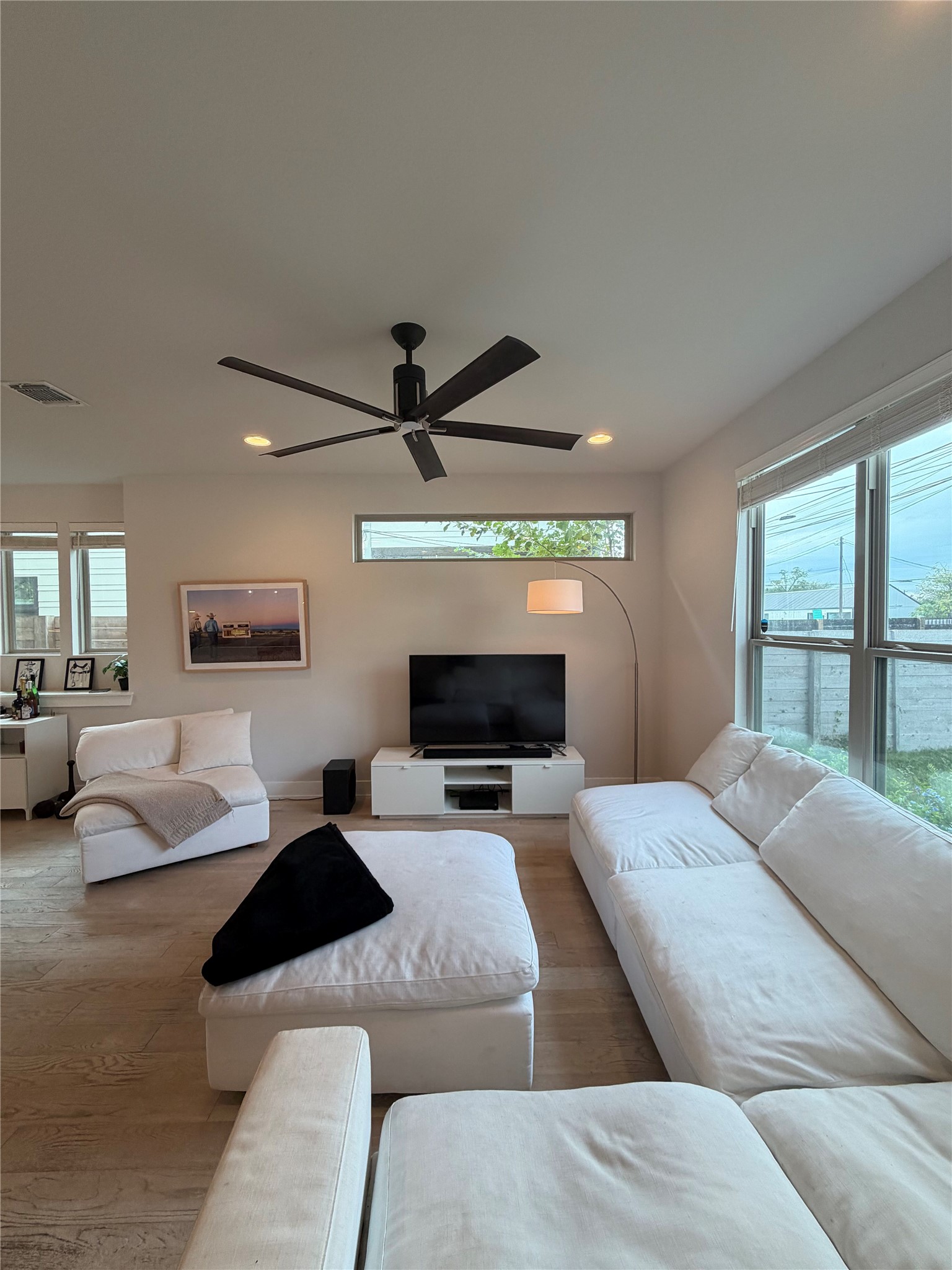 1159 Webberville Road, Unit A Austin, TX 78721 - Photo 3 of 26 Living area featuring wood finished floors, recessed lighting, and a ceiling fan