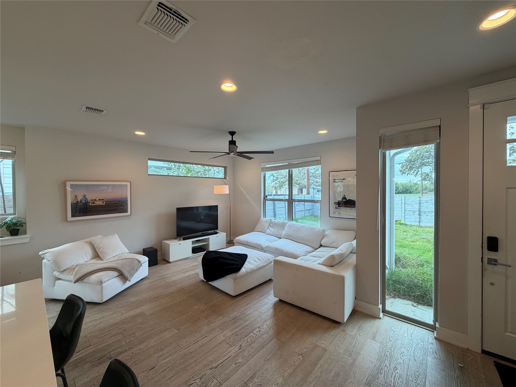 1159 Webberville Road, Unit A Austin, TX 78721 - Photo 5 of 26 Living room featuring recessed lighting, light wood-style flooring, and a ceiling fan