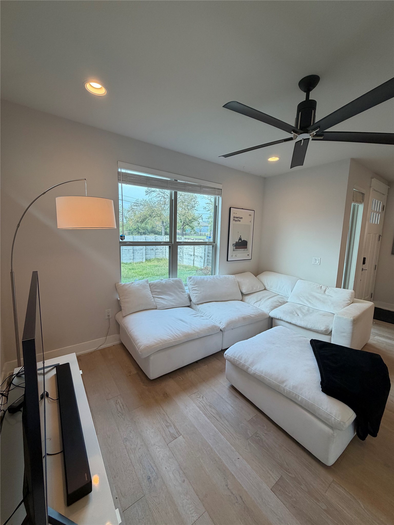 1159 Webberville Road, Unit A Austin, TX 78721 - Photo 6 of 26 Living area with recessed lighting, wood-type flooring, and a ceiling fan