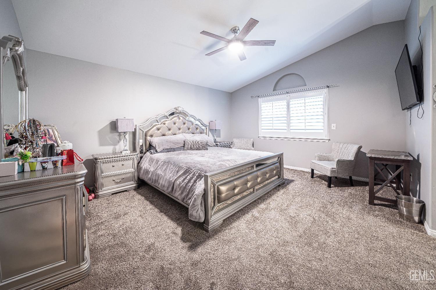 Undisclosed Address Bakersfield, CA 93312 - Photo 17 of 29 a bedroom with a bed a chair and a fireplace