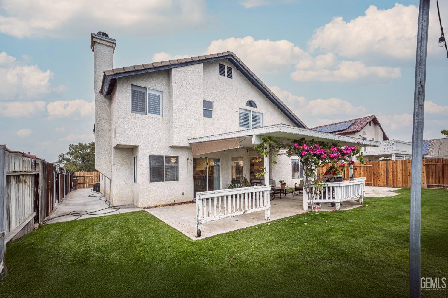 Undisclosed Address Bakersfield, CA 93312 - Photo 3 of 29 a view of a house with a yard and deck