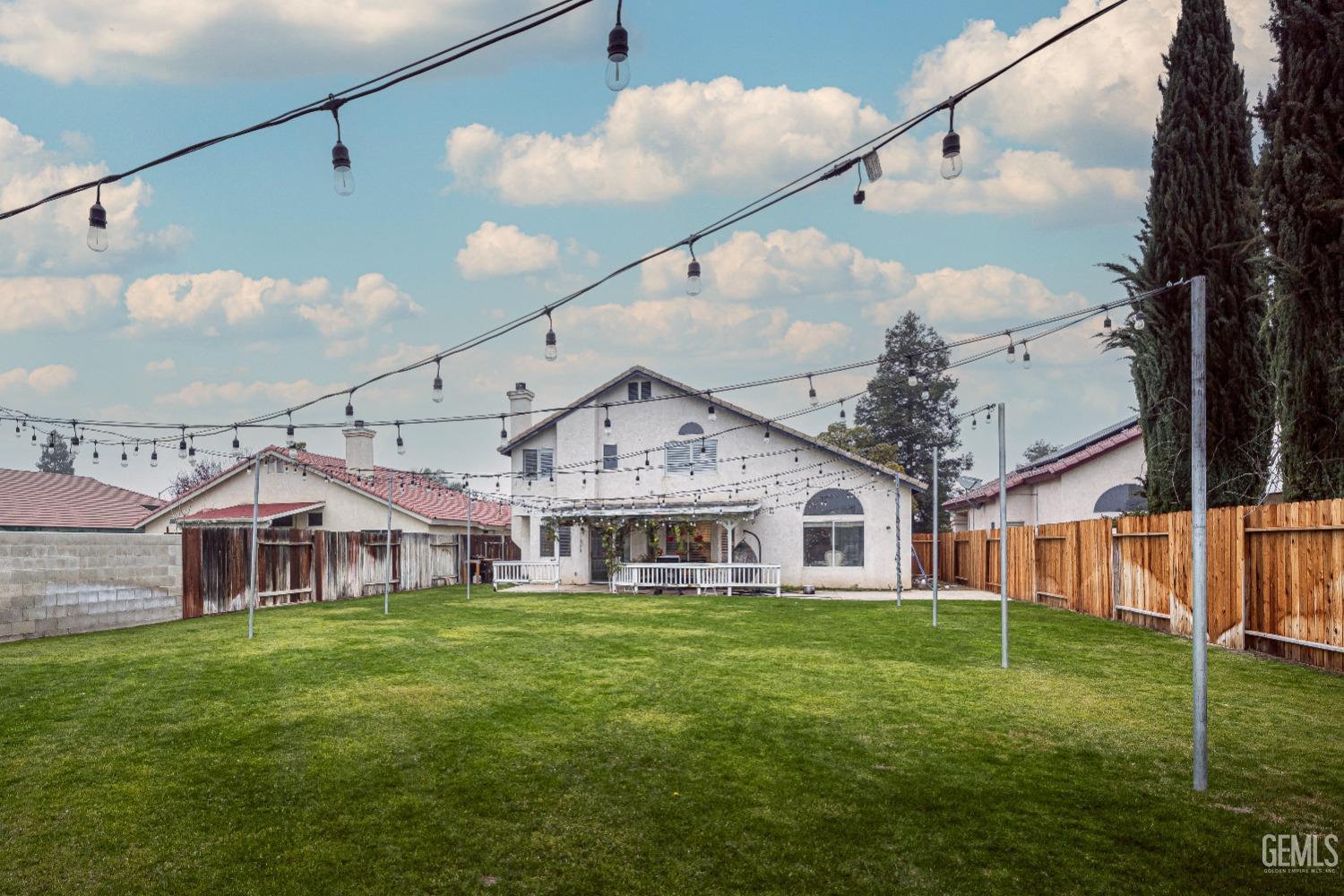Undisclosed Address Bakersfield, CA 93312 - Photo 4 of 29 a front view of a house with a yard