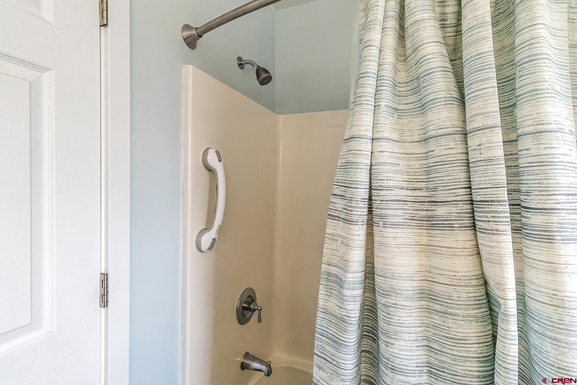 17656 2550th Road Cedaredge, CO 81413 - Photo 23 of 45 a bathroom with a shower
