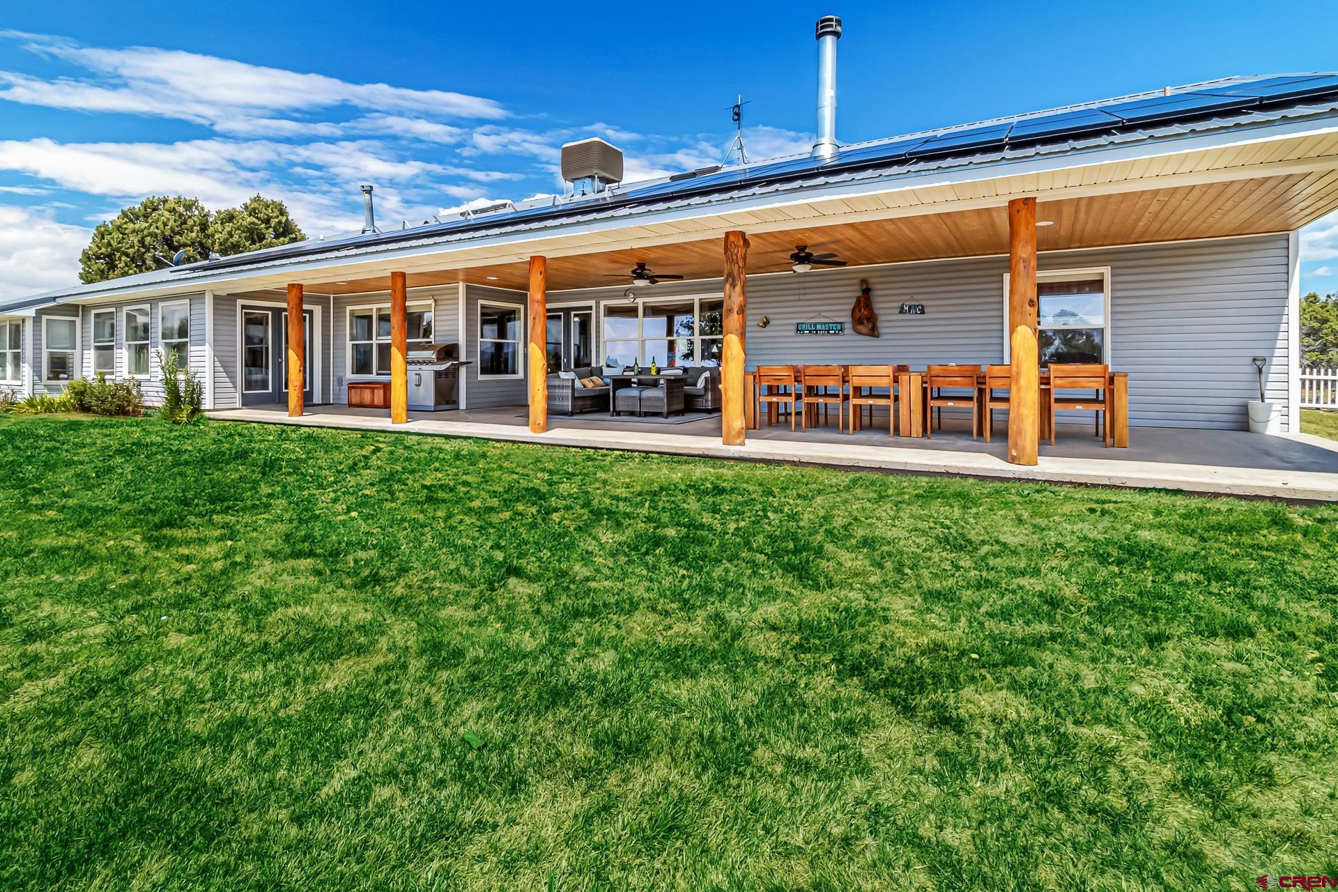 17656 2550th Road Cedaredge, CO 81413 - Photo 3 of 45 a view of a house with a swimming pool